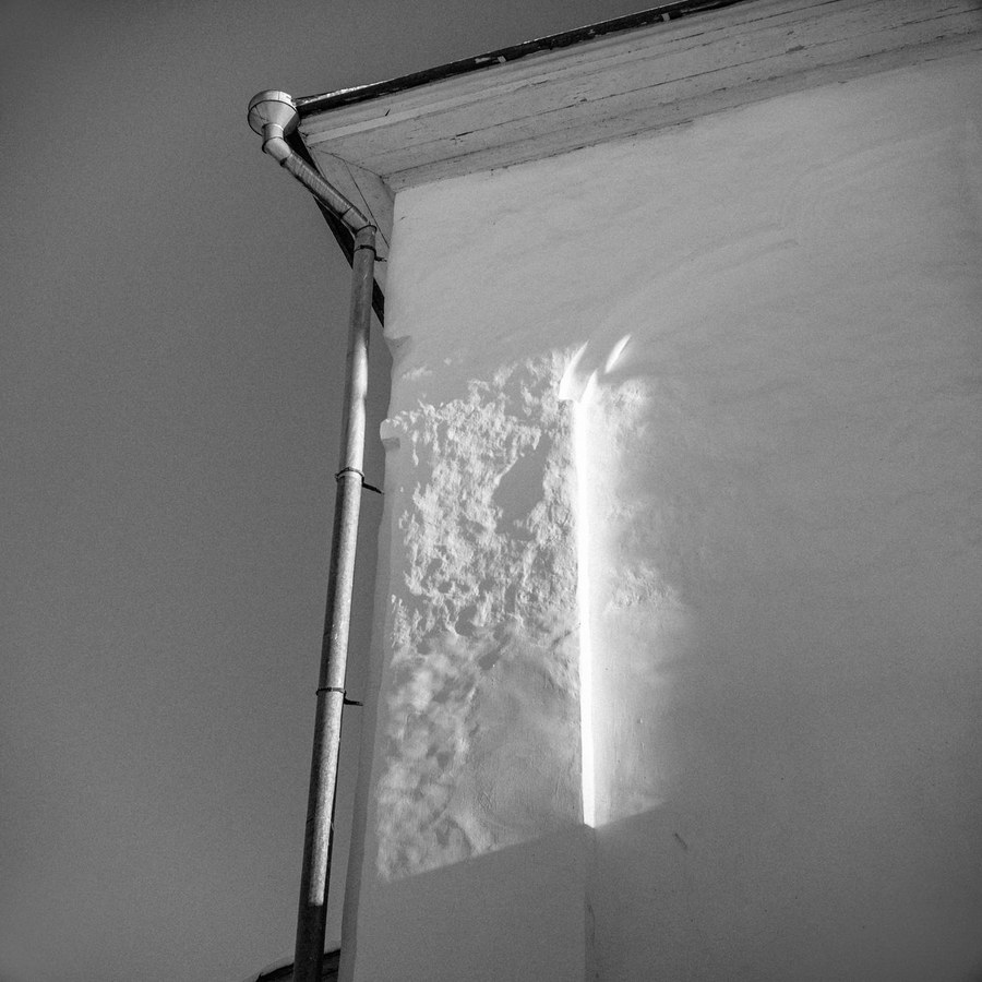 Close-up of hand tools and lime plaster mixing during restoration work