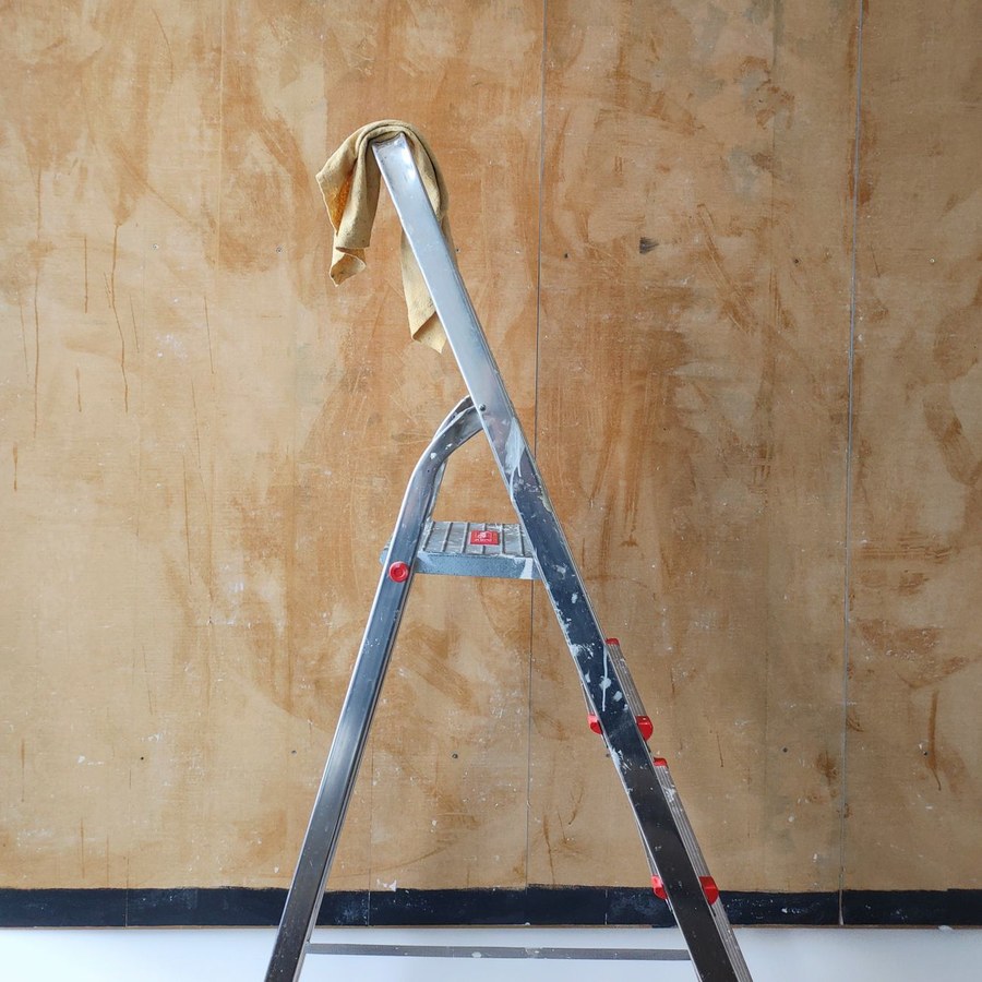 Craftspeople applying lime plaster finish with traditional hand tools