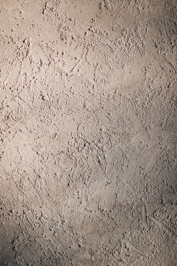 Close-up macro texture of traditional lime plaster with natural patina